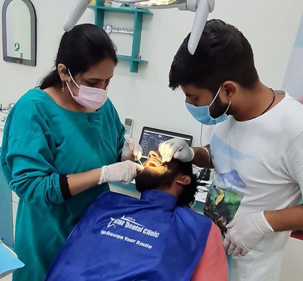 Dr. Shweta Kalra treating a patient at Star Dental Clinic, Hisar