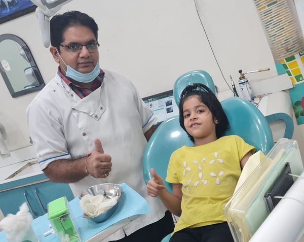 Dr. Tarun Kalra with a young patient